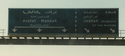 This highway sign indicates that non-Muslims must take the bypass around Mecca, where only Muslims are permitted